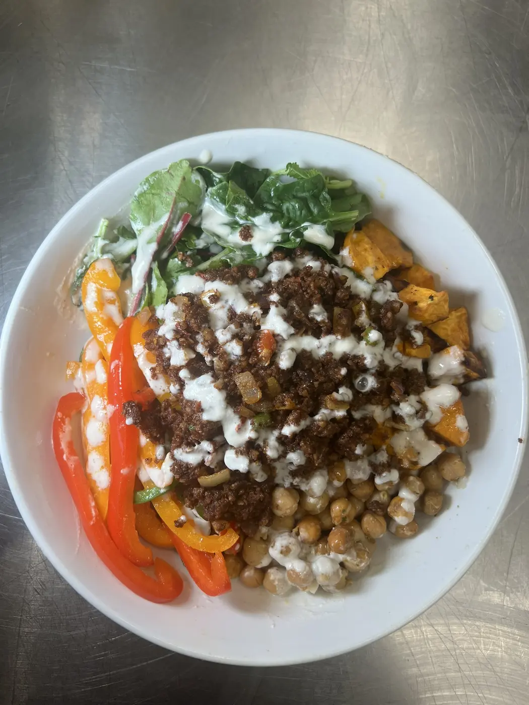 Caribbean Glow Bowl topped with whole-food vegan meat